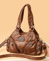 Vintage-Handtasche und Umhängetasche aus weichem Leder.